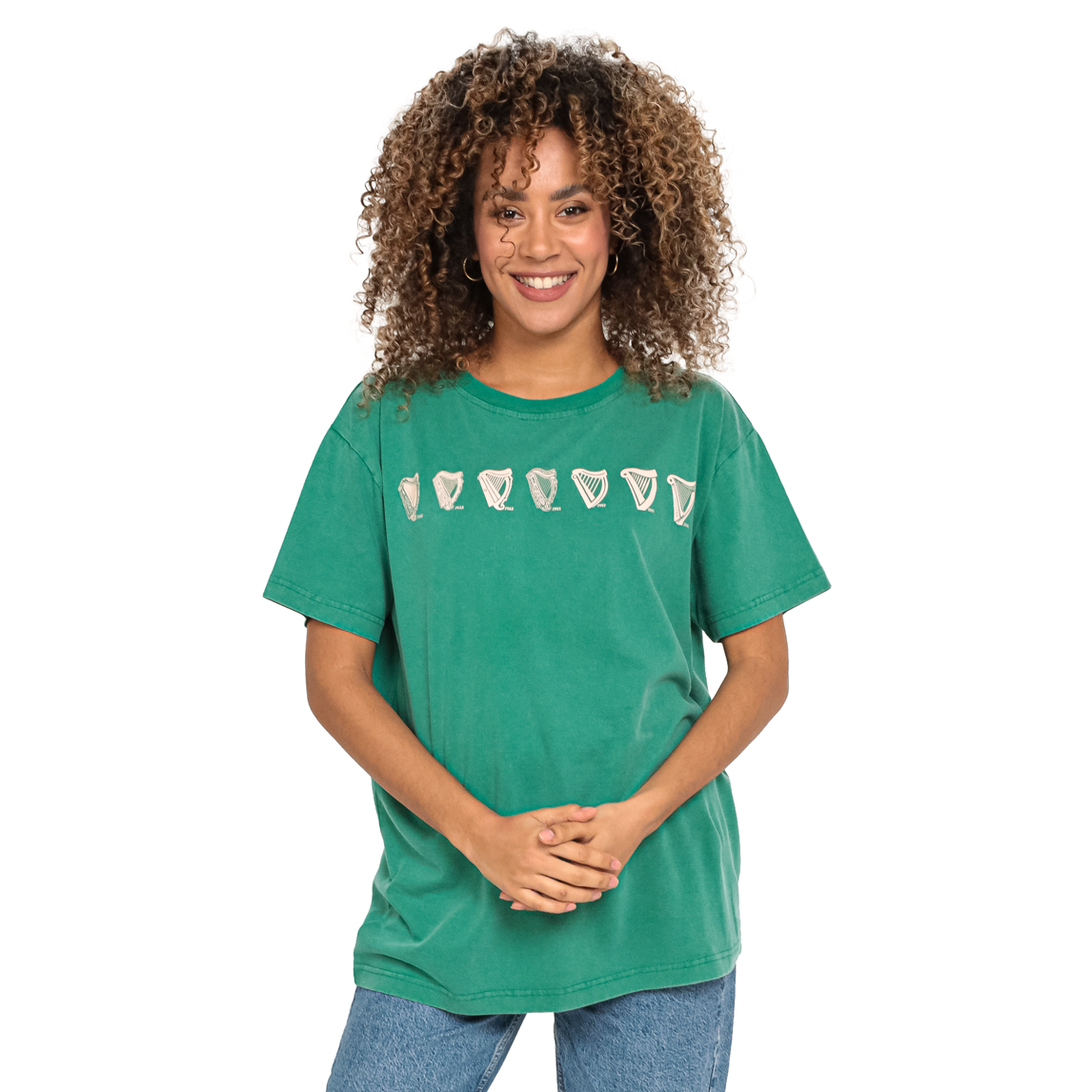 A woman wearing a green Guinness Evolution Harp Green T-shirt.
