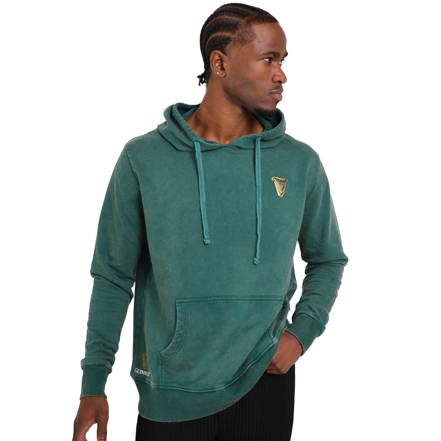 A man wearing a Guinness Forest Green & Gold Toucan Hoodie from the Guinness Webstore UK.