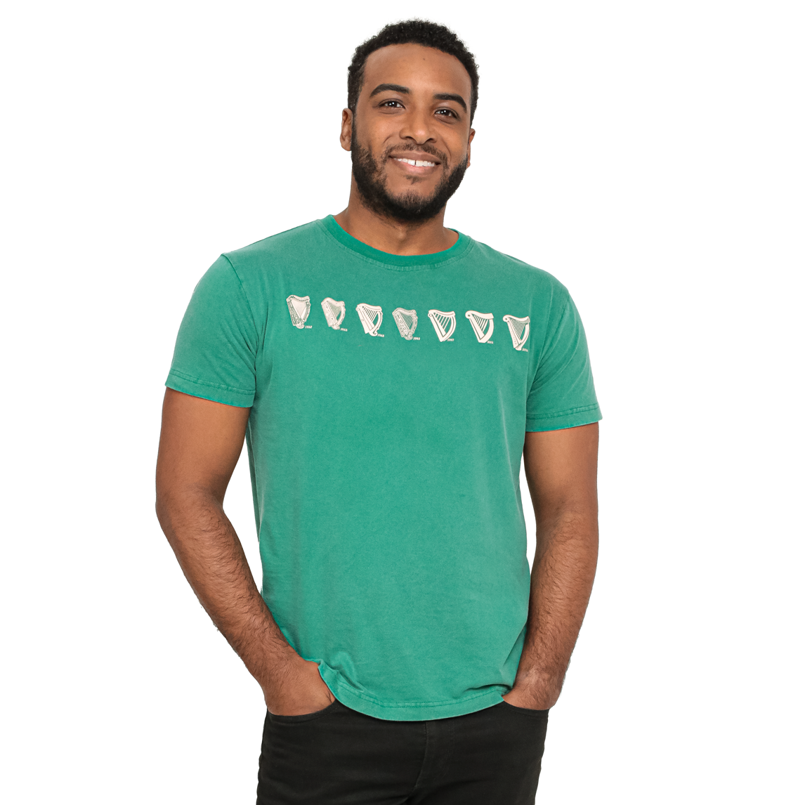 A man is smiling while wearing a green Evolution Harp Guinness T-Shirt.