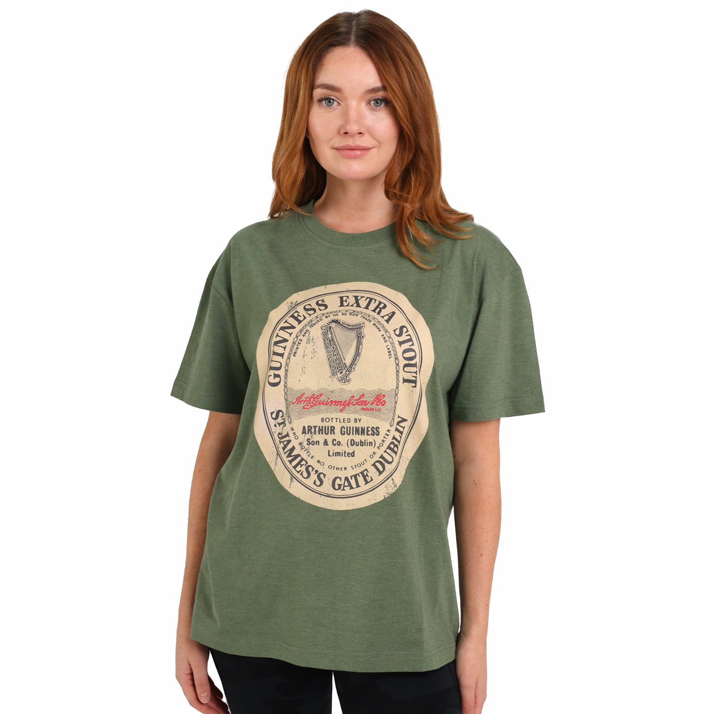 A woman wearing a Guinness® Green Distressed Irish Label T-Shirt with the Irish flag on it.