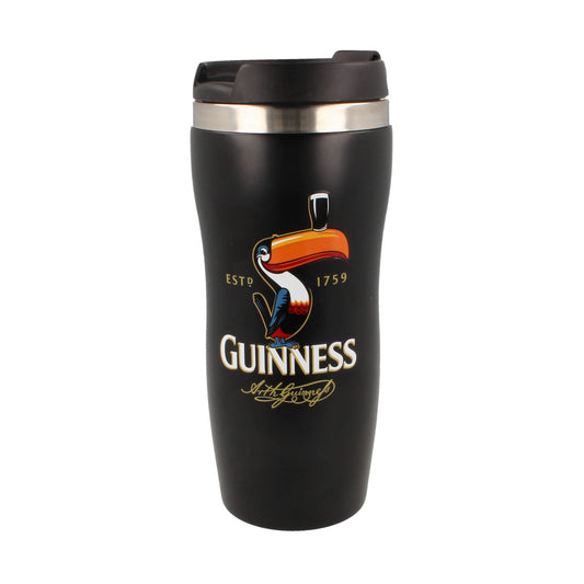 The Guinness Gilroy Travel Mug from Guinness Webstore UK showcases a quirky design with a black finish, featuring a toucan holding a pint and the "Guinness Gilroy Estd 1759" text.