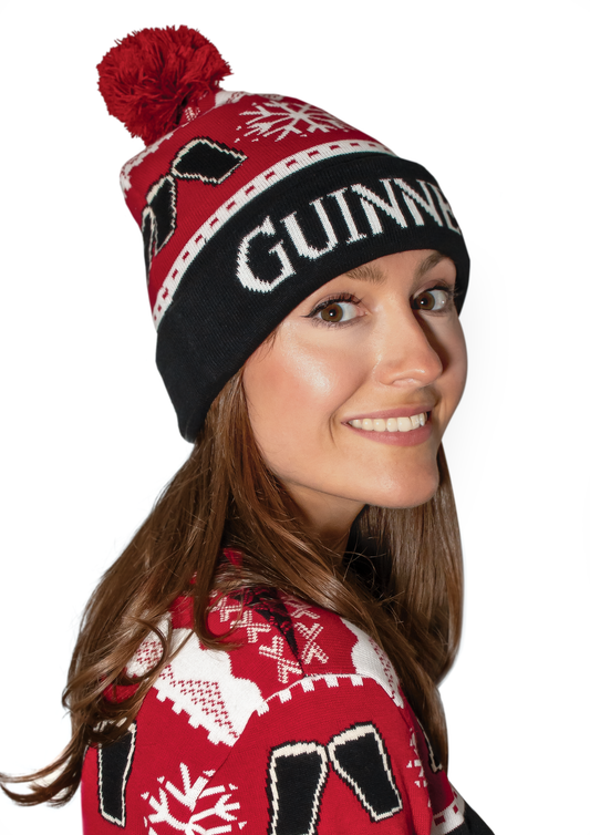 A woman wearing the Official Guinness Christmas Beanie by Guinness UK.