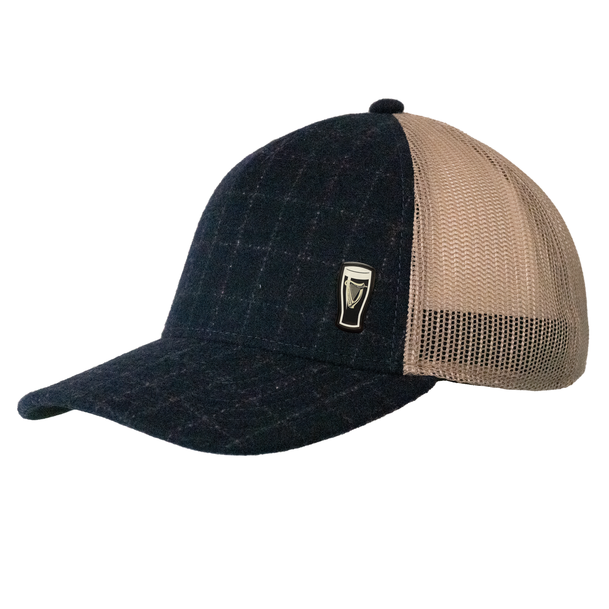 The Guinness Checked Trucker Cap from Guinness Webstore UK features dark plaid, a beige mesh back, denim-textured navy accents, and a pint glass emblem on the front—blending classic Irish heritage with modern style.