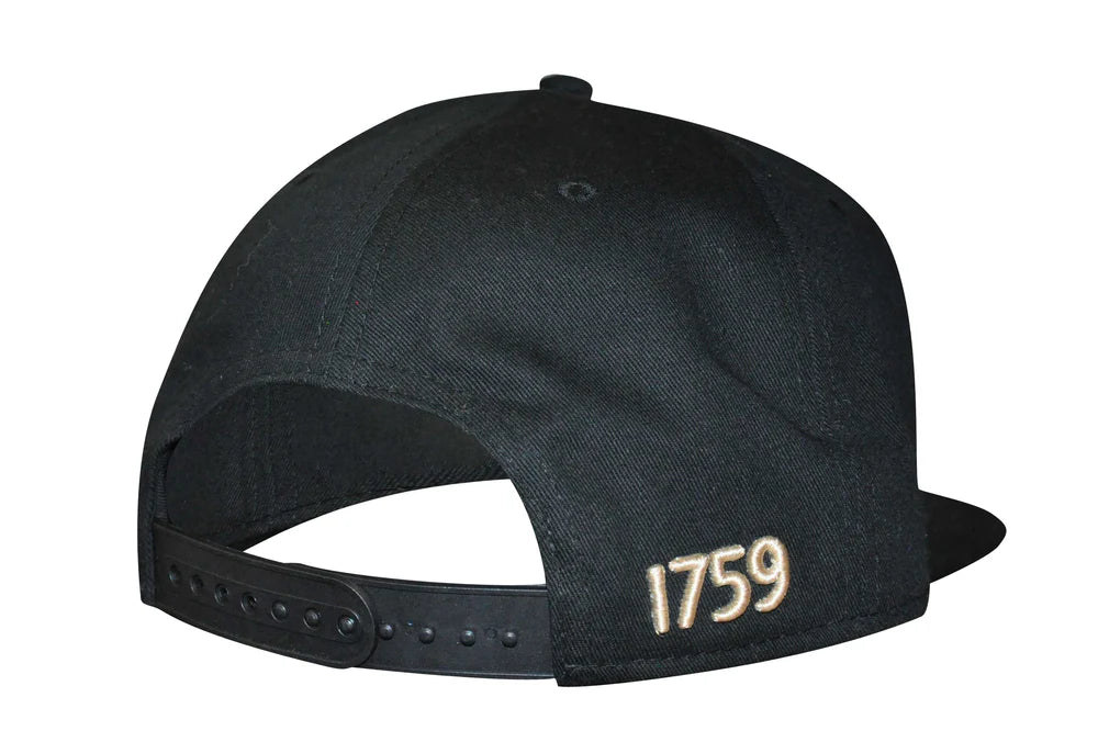 The Guinness UK Flat Brim Baseball Cap boasts a sleek black design with "1759" delicately embroidered in gold on the side. It features a convenient snapback closure system for an adjustable fit, merging timeless style with contemporary comfort.