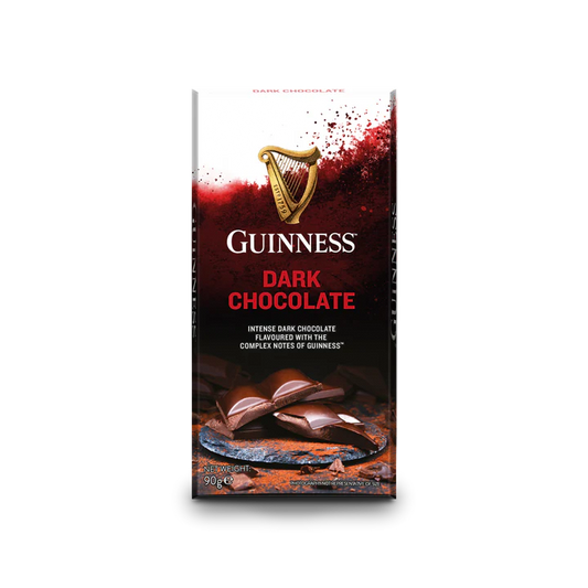 The packaging of the Guinness Luxury Dark Chocolate Bar showcases a peeling chocolate bar alongside the iconic Guinness logo, accompanied by the description "Intense dark chocolate flavored with the complex notes of Guinness." This luxurious treat is elegantly offered in a 90g bar, ideal for those desiring indulgence.