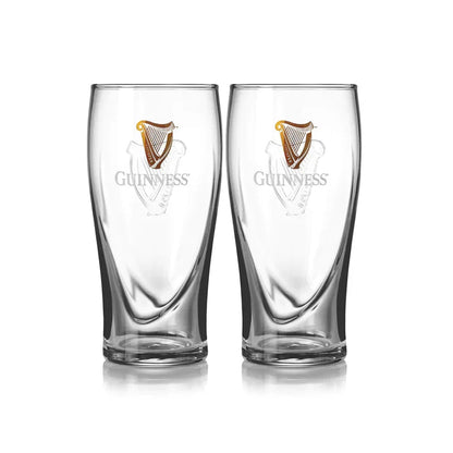 Two clear pint glasses from the Guinness Nitrosurge Gift Bundle by Guinness UK, featuring the iconic logo and harp, expertly crafted to enhance your experience with nitrogen bubbles from the GUINNESS NITROSURGE system.