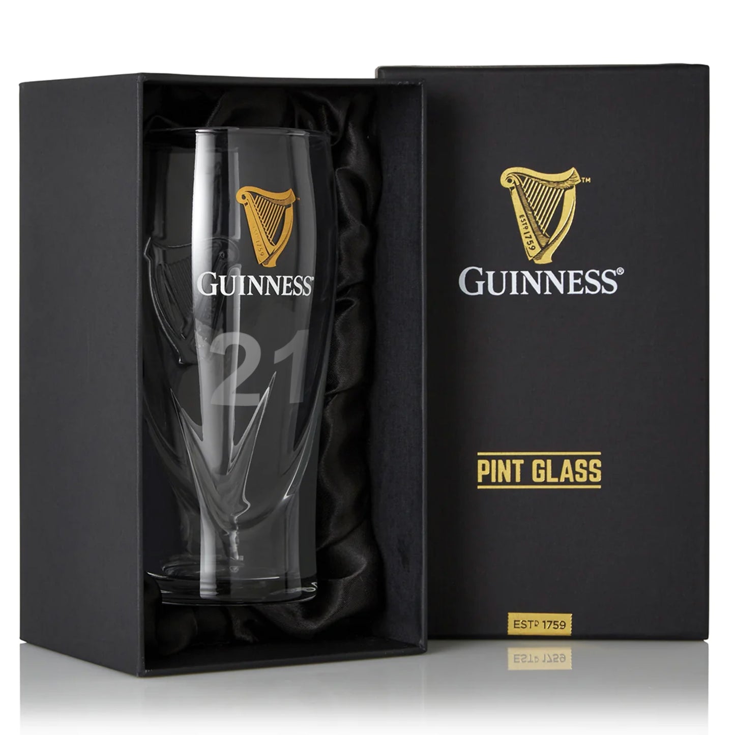 The Guinness Pint Glass is elegantly displayed in an open black box, featuring the iconic Harp Logo and "Pint Glass" text. It's essential for any collector of Guinness Official Merchandise.