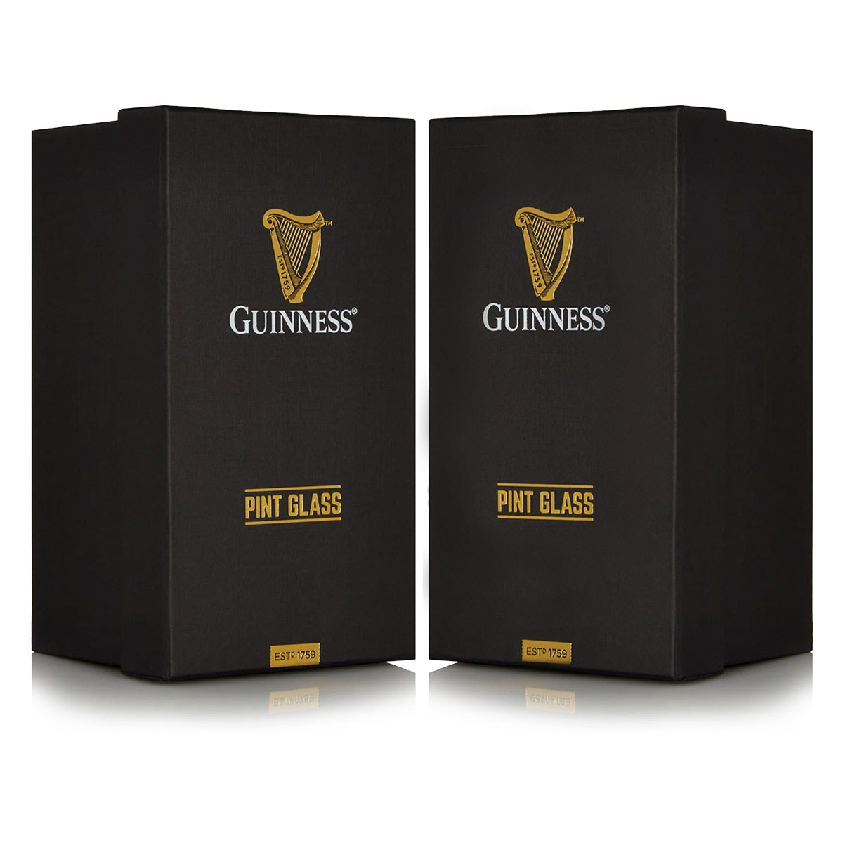 Two black boxes labeled "Guinness Toucan Pint Glass" with gold lettering and the iconic harp logo are pictured against a white background, showcasing official merchandise from Guinness UK.