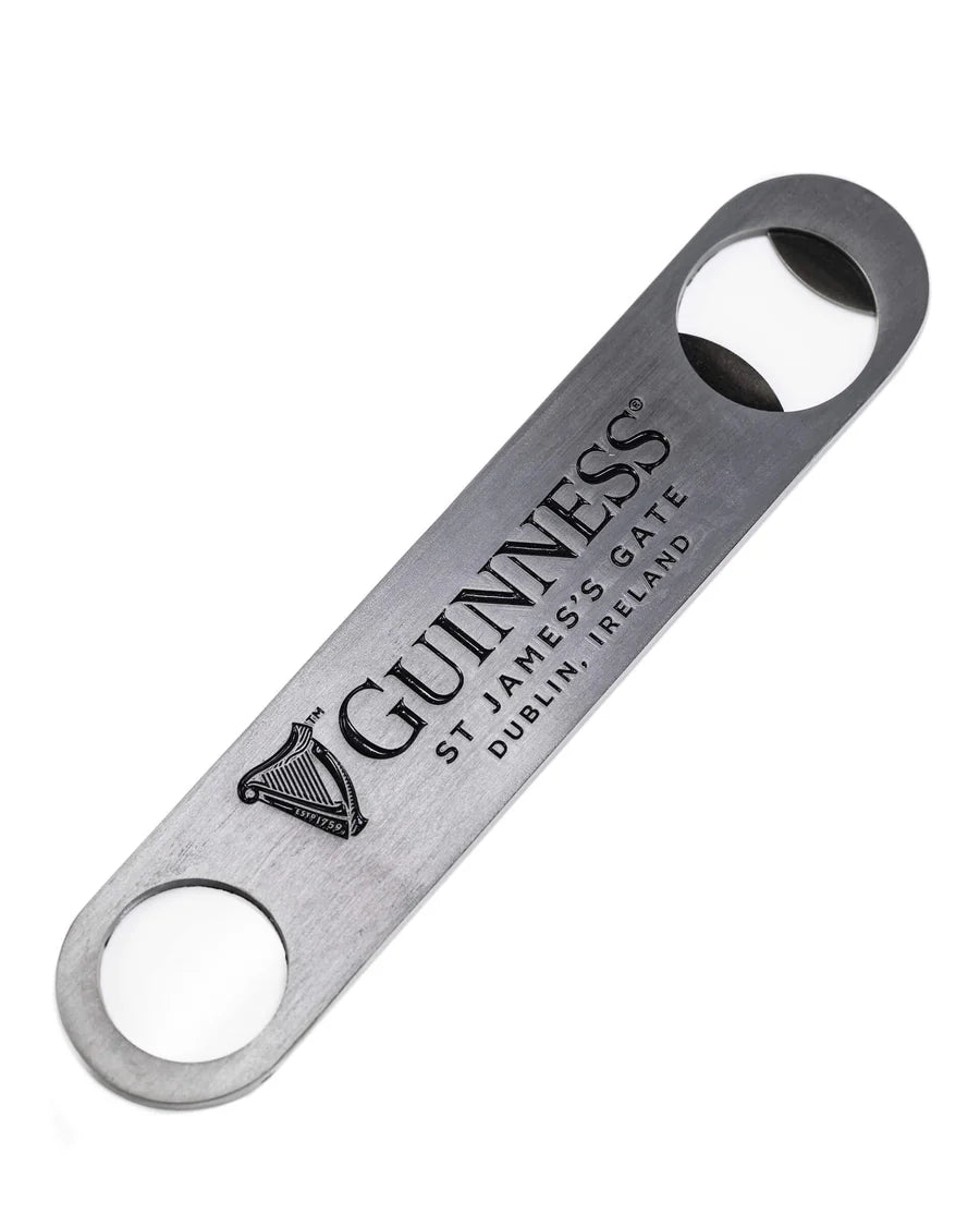 The Guinness Barman Bottle Opener from Guinness Webstore UK is crafted from high-quality steel and engraved with "Guinness" and "St. James's Gate, Dublin, Ireland." It includes two round holes, making it the perfect bar tool for any enthusiast.