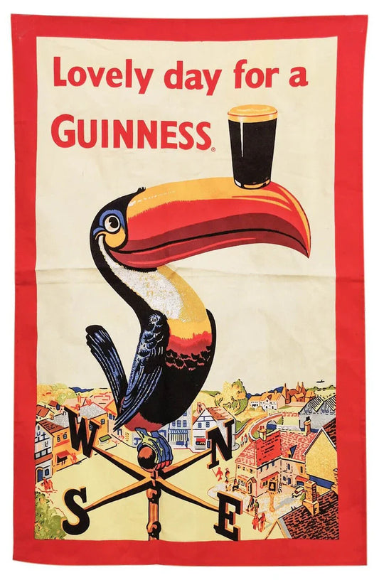 Featuring the iconic toucan balancing a pint with “Lovely day for a Guinness,” the Guinness Toucan Tea Towel from Guinness brings vintage style to your kitchen décor.