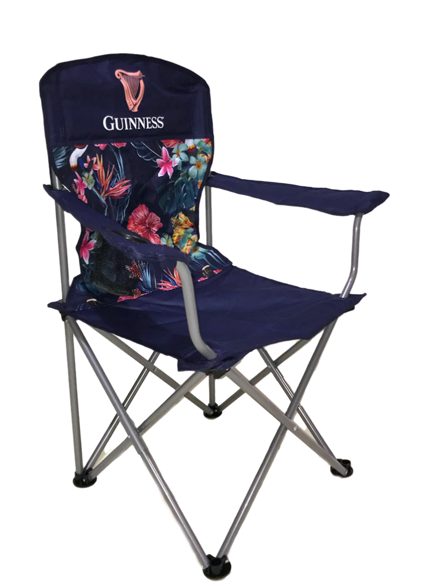 The Guinness Toucan Hawaiian Beach Chair from Guinness Webstore UK features a blue floral fabric with the "Guinness" logo on the backrest, sturdy metal legs and armrests, combining style and comfort for any outdoor gathering.