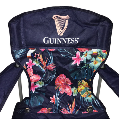 A navy Guinness Toucan Hawaiian Beach Chair from the exclusive Guinness collection features a floral-patterned backrest with the Guinness logo and harp symbol. Available at Guinness Webstore UK.