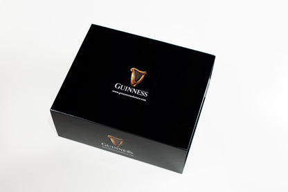 A large collector's edition box, branded as the Guinness Gift Box, features the iconic Guinness logo and website printed on the top.