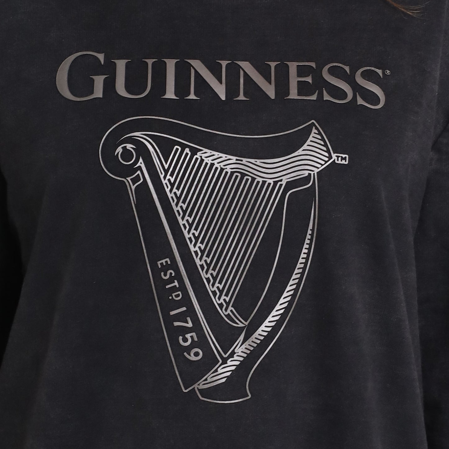 The Guinness Metallic Print Trademark Sweatshirt from Guinness Webstore UK features the Guinness logo above a large metallic harp graphic with "EST. 1759" on it.