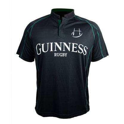 The Guinness Black & Green Short Sleeve Rugby Jersey features a Celtic pattern, “Guinness” and “Rugby” text, and a rugby ball graphic on the front.