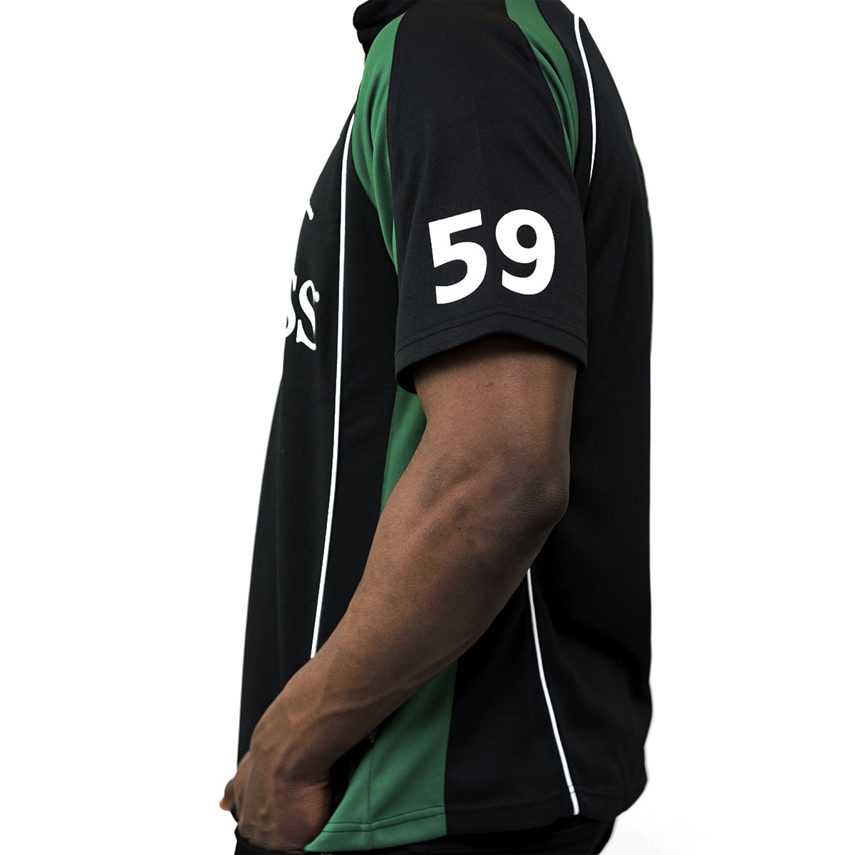 A man wearing a Guinness UK Black and Green Short sleeve performance Rugby Jersey.