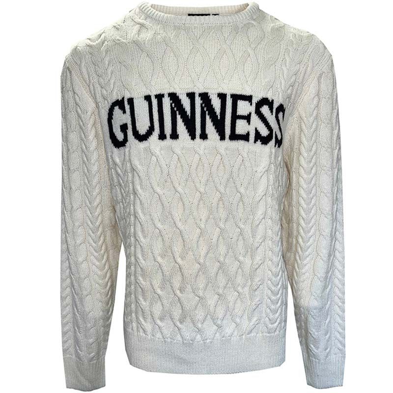 The Guinness Cream Cable Knit Jumper, an essential for winter, showcases "GUINNESS" in bold black letters across the chest, combining traditional style with cozy comfort.