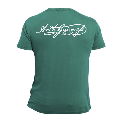 Green short-sleeve graphic tee, the Guinness Gaelic Label Green Premium T-Shirt by Guinness UK, featuring white cursive text on the back. Crafted from premium materials.