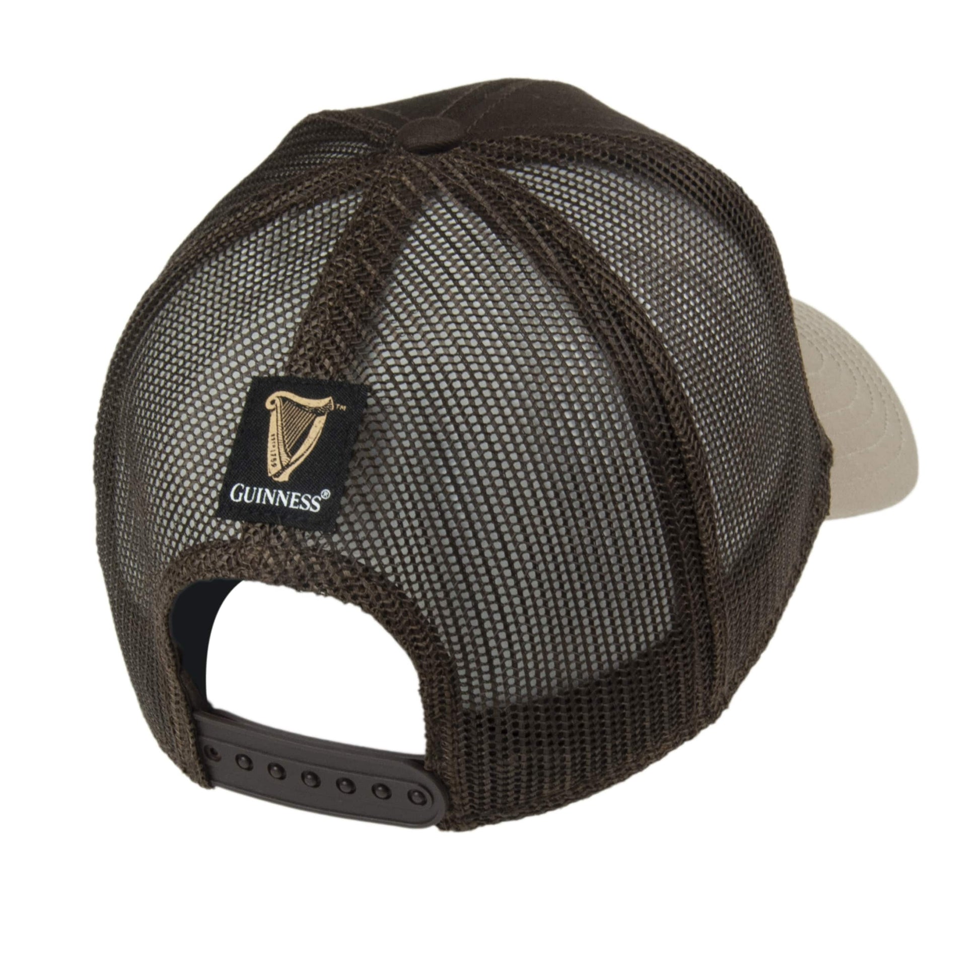Black mesh Guinness UK Trucker Premium Brown with Embroidered Patch Cap, showcasing adjustable snapback closure and curved peak, isolated on a white background.