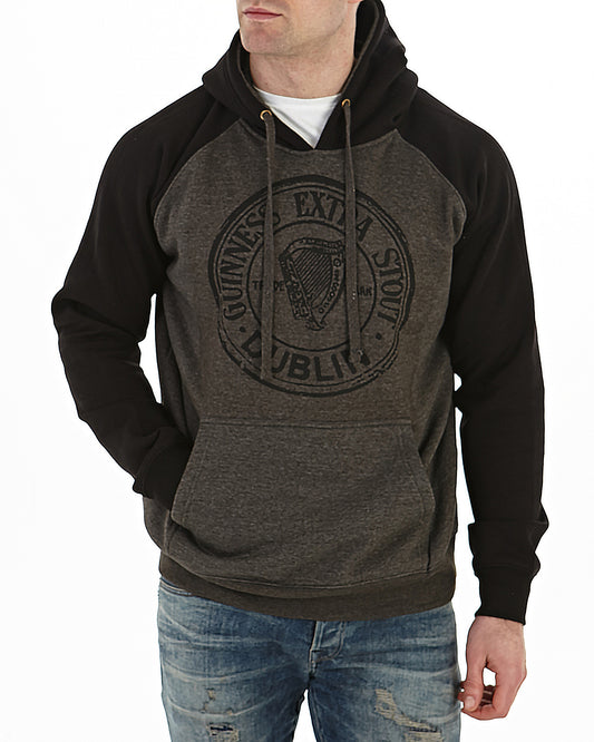 A man wearing a Guinness Extra Stout Charcoal Label Beer Bottle Hoodie.