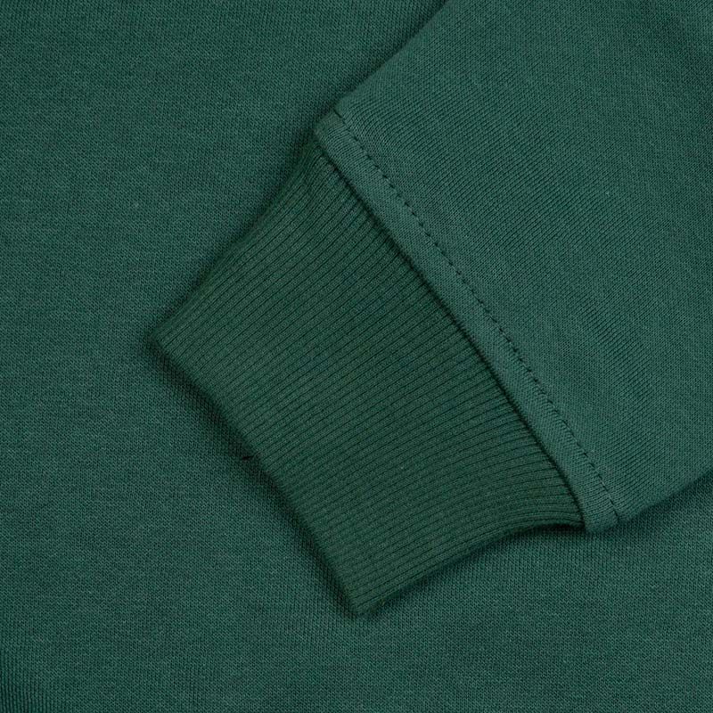 Close-up view of a Guinness Bottle Green Unisex Hoodie fabric texture with a focus on the ribbed cuff detail.