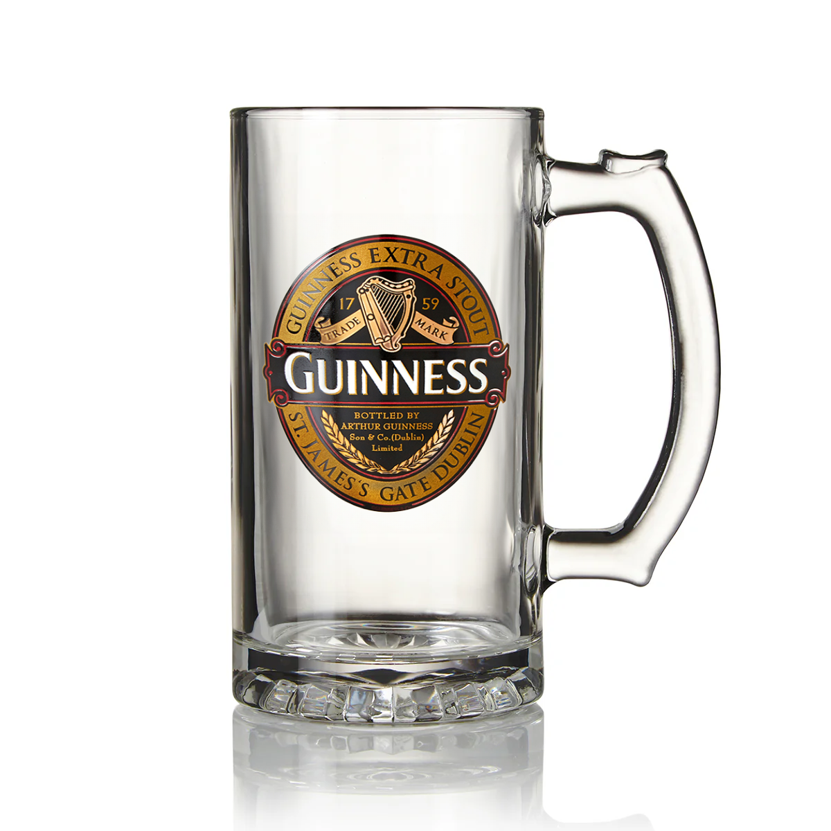 The Guinness Classic Tankard, available from the Guinness Webstore UK, is a clear glass tankard featuring a label for Guinness Extra Stout adorned with gold and red accents. It includes an Irish harp motif along with a decorative circular pattern on the bottom.